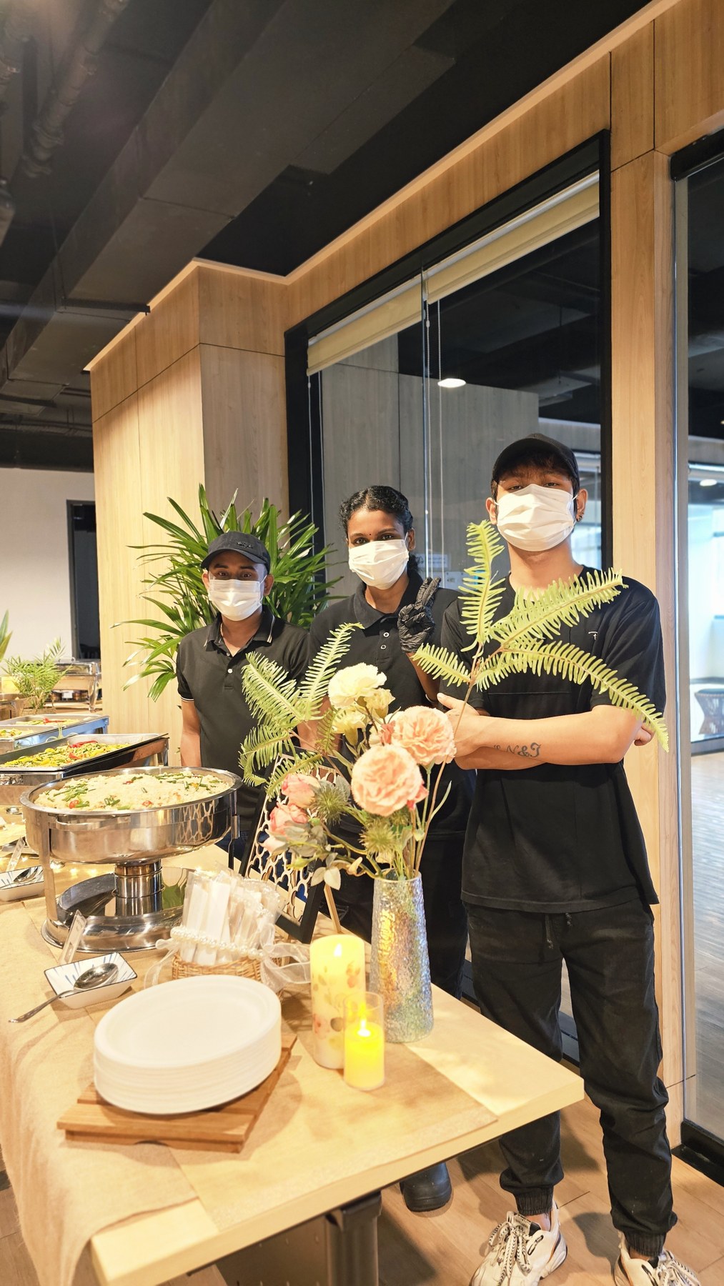 Darun catering team behind an arranged buffet