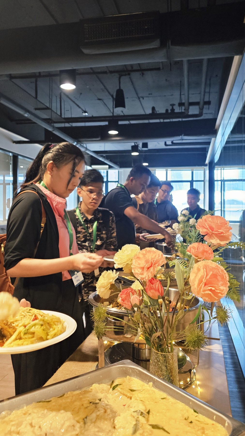 Guests enjoying a buffet at a corporate gathering