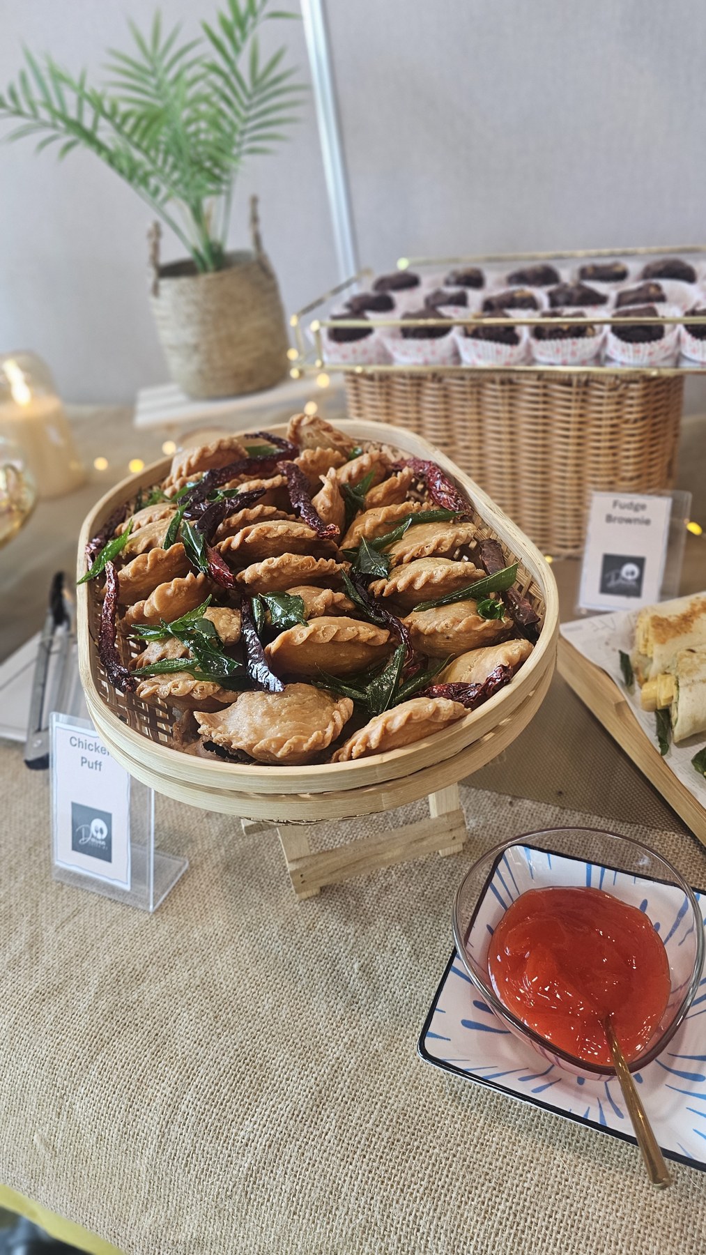 Dumplings presented in a bamboo steamer on the buffet