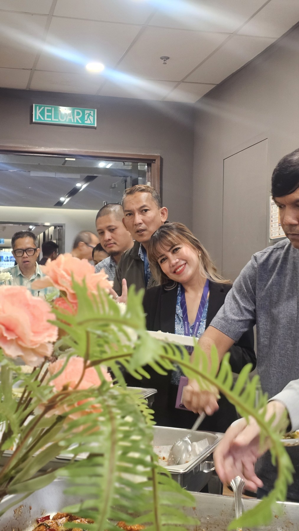 Guests gathered around a decorated catering spread