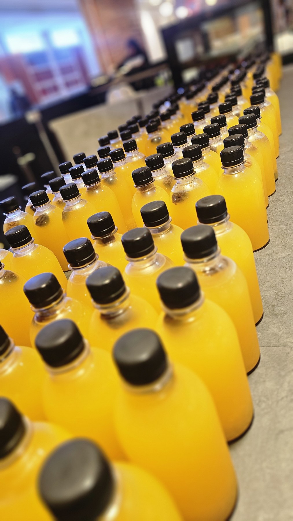 Rows of individually bottled orange drinks
