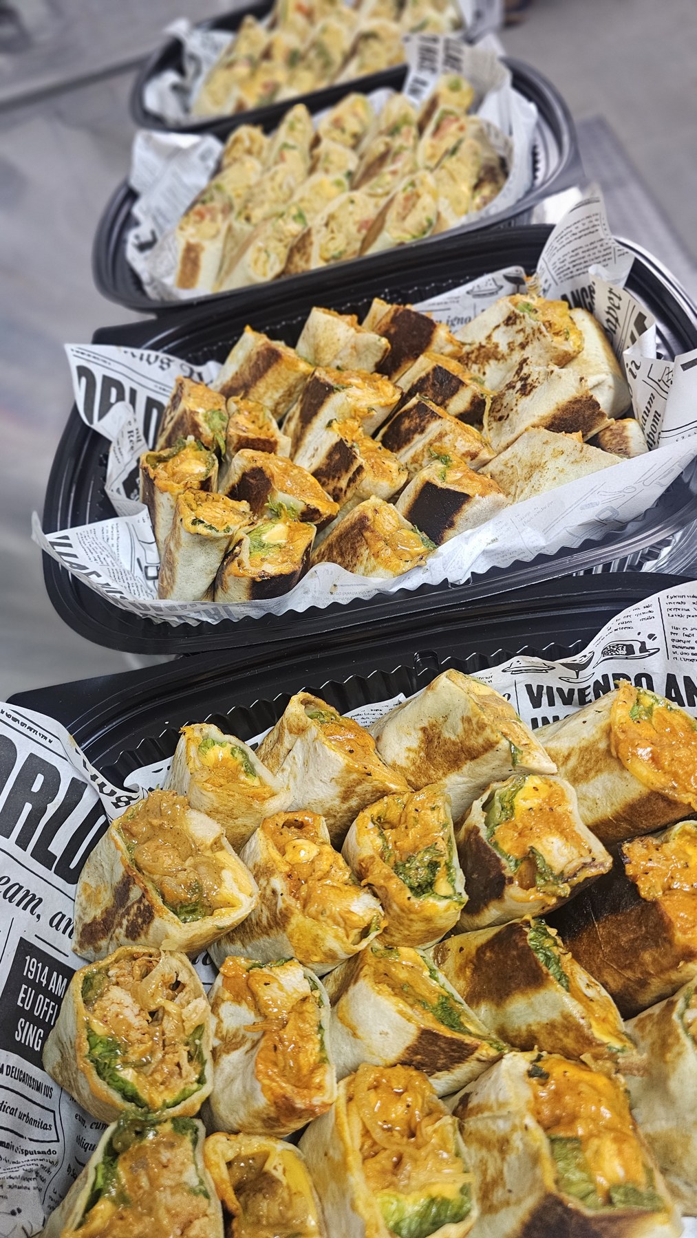 Bite-sized toasted wraps presented in catering trays
