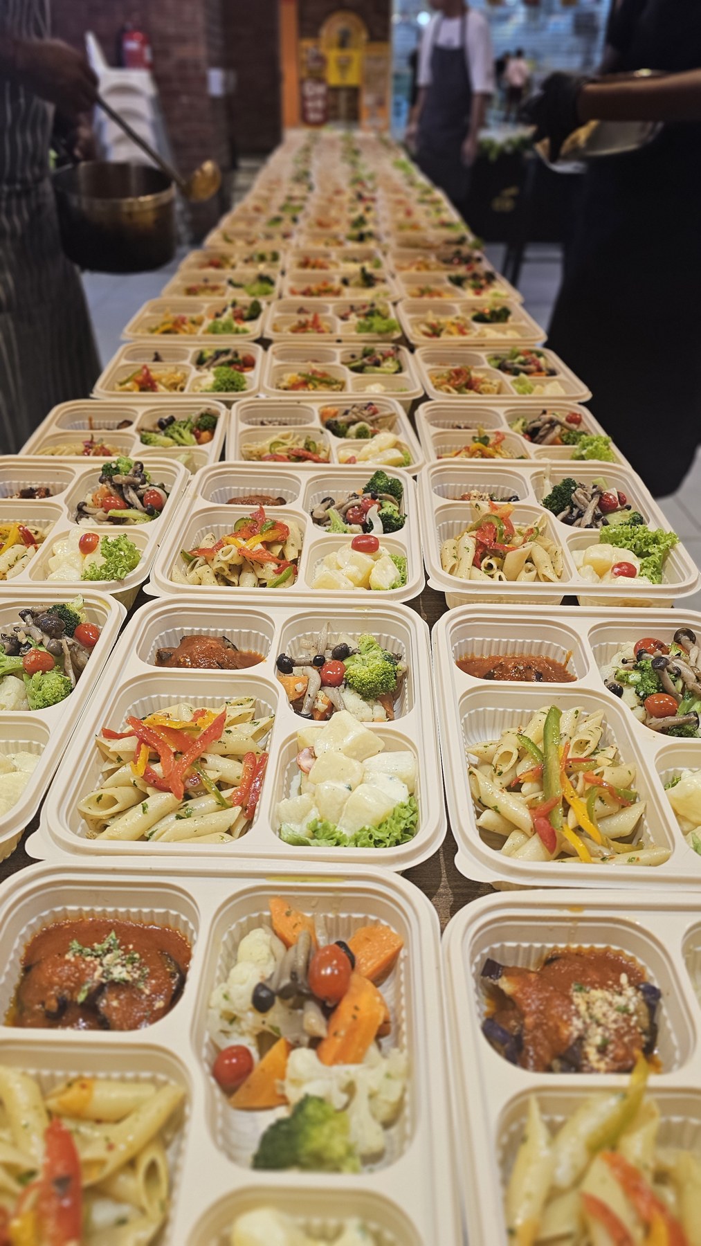 Rows of bento meals arranged for event catering