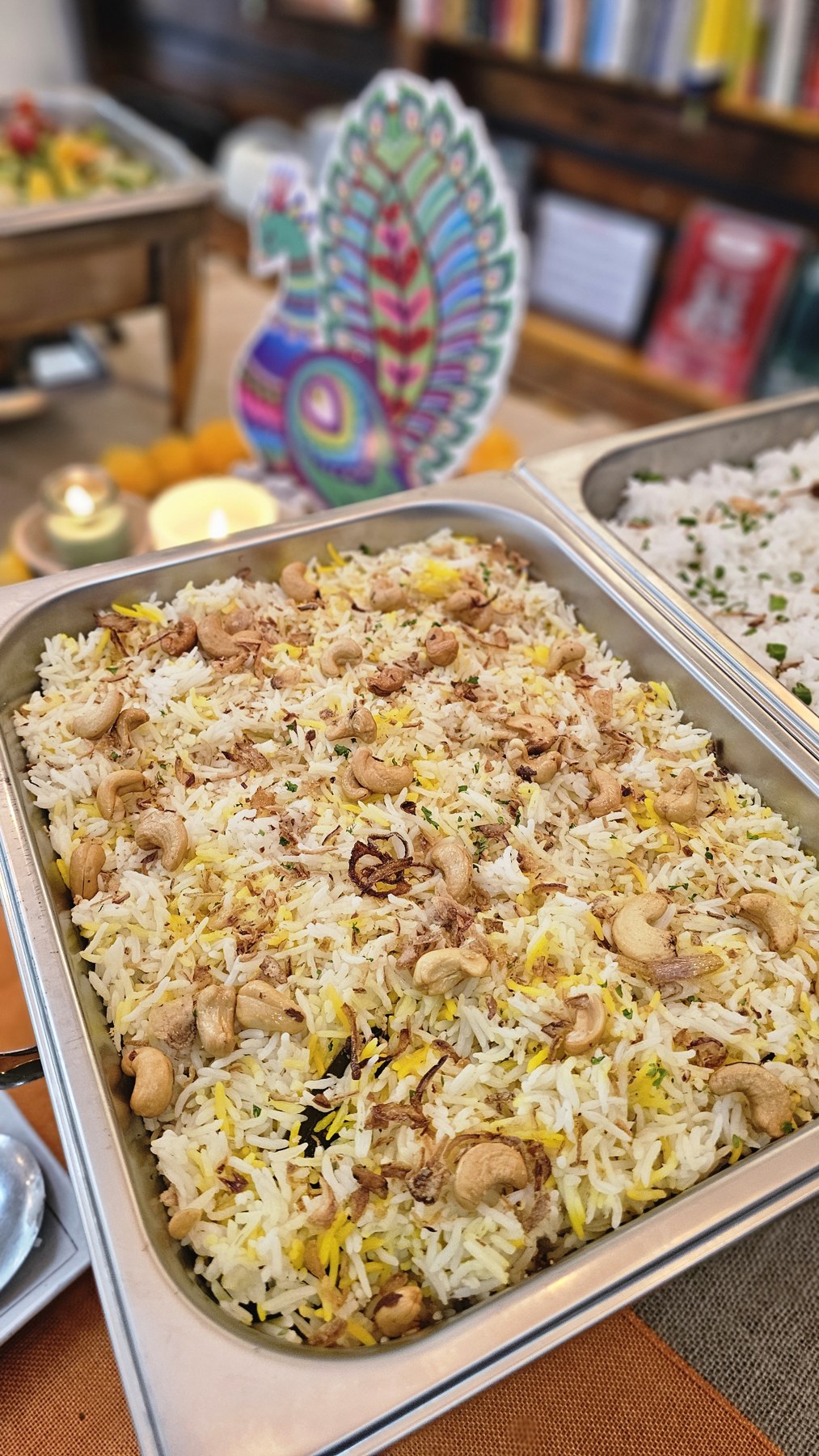 Fragrant rice garnished with cashews at a Darun buffet