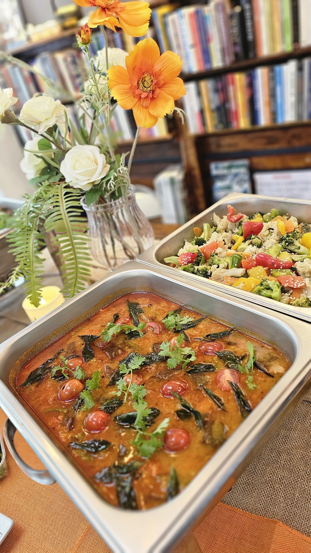 Curry and mixed vegetables presented in buffet trays