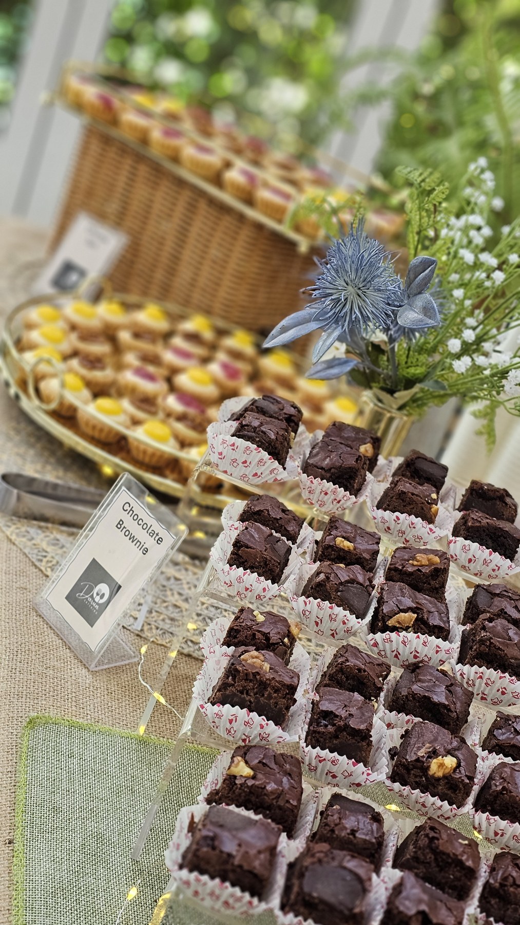 Chocolate and layered desserts on a decorated catering display