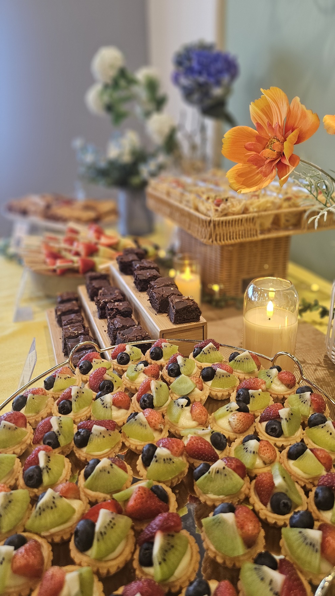 Darun finger foods, desserts and fruit arranged on a buffet table